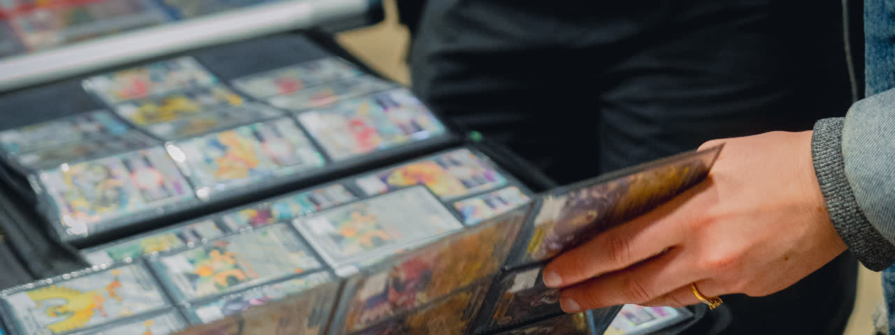 Graded slabs laid out in rows across a trading table.