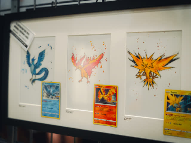 Original artwork of the legendary birds hung above a print stand.