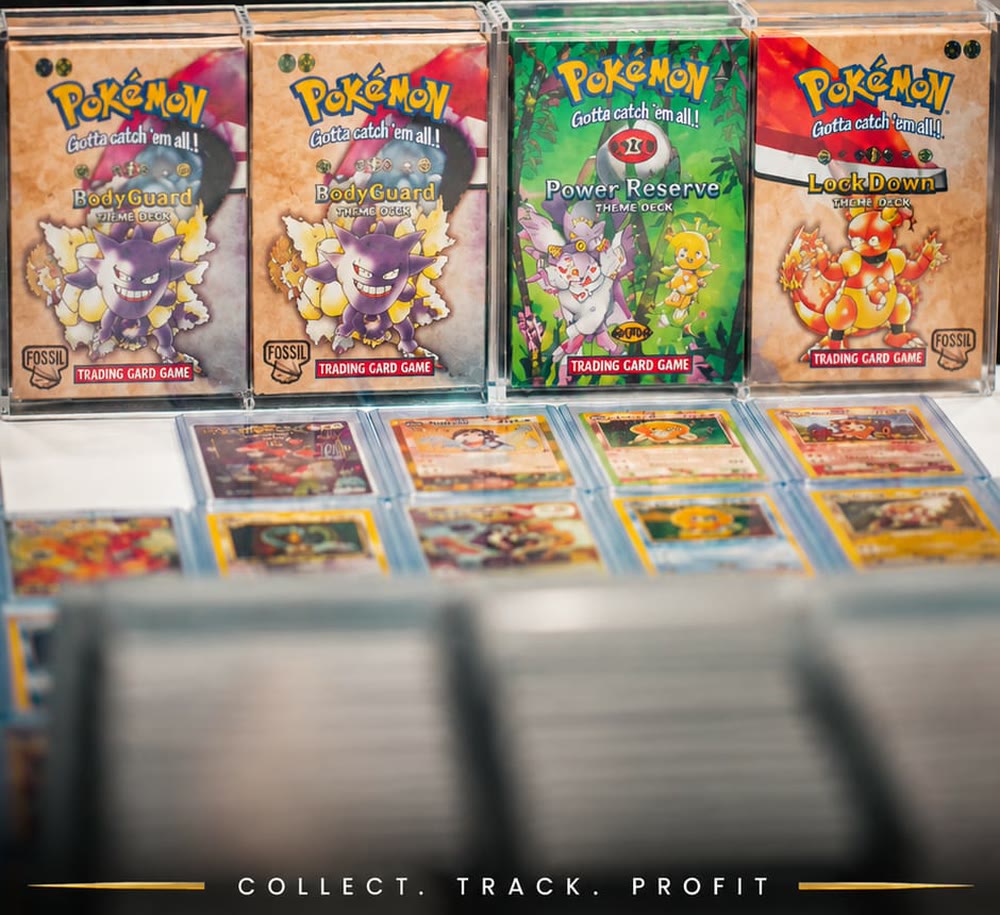 Four sealed vintage Pok&eacute;mon theme decks in cases, above two rows of graded cards