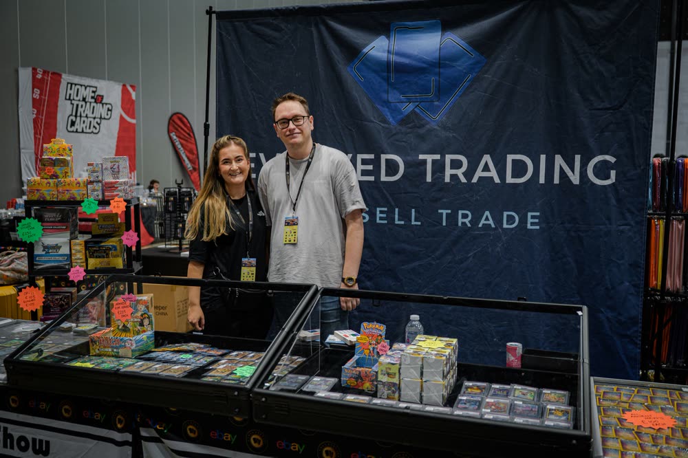 Two of the Evolved Trading team behind their stand