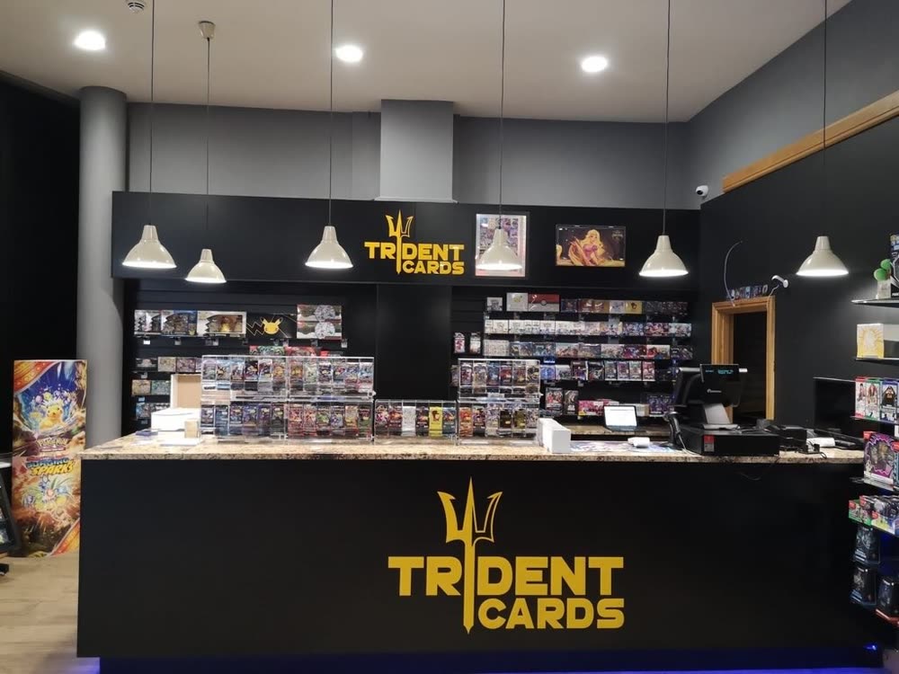 The Trident Cards counter and shelves inside their store